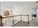 Upstairs hallway overlooking foyer with natural light from large arched window at 4354 Summit Vw, Marietta, GA 30066