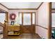 Welcoming foyer with wood floor, staircase, pink walls, and door with blinds at 714 Lanford Springs Sw Dr, Lilburn, GA 30047