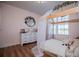 Charming bedroom with wood floors and a unique house bed at 1285 E Hwy 5, Carrollton, GA 30116