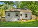 Rear view of house with small patio and yard at 2013 Glenwood Se Ave, Atlanta, GA 30316