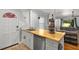 Kitchen with butcher block island and open concept to living room at 2013 Glenwood Se Ave, Atlanta, GA 30316