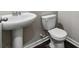 Clean bathroom with pedestal sink and toilet at 4499 Lombard Rd, Ellenwood, GA 30294