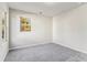 Spacious bedroom with a window and neutral-colored walls at 4499 Lombard Rd, Ellenwood, GA 30294