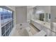 Bathroom with double vanity and large soaking tub at 1361 Log Cabin Se Ln, Lawrenceville, GA 30045