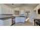 White kitchen with granite countertops and stainless steel appliances at 1361 Log Cabin Se Ln, Lawrenceville, GA 30045