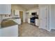 White kitchen with granite countertops and stainless steel appliances at 1361 Log Cabin Se Ln, Lawrenceville, GA 30045