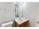 Clean bathroom with wood vanity and updated fixtures at 2530 Willenhall Way, Lithonia, GA 30058