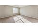 Sunlit bedroom with a window and neutral carpet at 2530 Willenhall Way, Lithonia, GA 30058