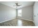 Spacious bedroom with hardwood floors and window at 8115 Lockslay Way, Suwanee, GA 30024