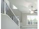 Elegant staircase with wrought iron balusters and white risers at 8115 Lockslay Way, Suwanee, GA 30024