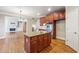 Spacious kitchen with granite countertops and ample wood cabinets at 965 Gardiner Cir, Suwanee, GA 30024