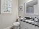 Clean bathroom with granite countertop and updated fixtures at 1020 Leslie Pl, Lithonia, GA 30058