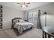 Bedroom with a queen bed, window, and gray accents at 1020 Leslie Pl, Lithonia, GA 30058