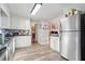 Kitchen boasts granite countertops, stainless steel appliances, and light-colored cabinetry at 1020 Leslie Pl, Lithonia, GA 30058