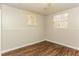 Unfinished basement room with two windows and wood-look floors at 1034 Sandy Ridge Rd, Mcdonough, GA 30252