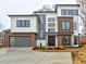 Modern two-story home with wood and white siding, and a gray two-car garage at 2255 Shallowford Rd, Marietta, GA 30066