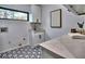 Modern laundry room with white cabinets and patterned tile floor at 2255 Shallowford Rd, Marietta, GA 30066