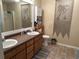 Bathroom boasts double vanity and decorative accents at 350 Chestnut Dr, Covington, GA 30016