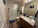Bathroom with a shower/tub combo and vanity at 350 Chestnut Dr, Covington, GA 30016