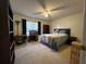 Bedroom with a queen bed and built-in shelving at 350 Chestnut Dr, Covington, GA 30016