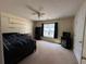 Spacious bedroom with carpeted floor, window, and ceiling fan at 350 Chestnut Dr, Covington, GA 30016