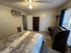 Bedroom with a queen bed, desk, and bookshelf at 350 Chestnut Dr, Covington, GA 30016