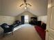 Spacious bonus room with carpet and a futon at 350 Chestnut Dr, Covington, GA 30016
