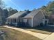 Side view of a ranch style home with a walkway at 350 Chestnut Dr, Covington, GA 30016