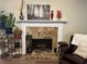 Stone fireplace with a white mantel in the living room at 350 Chestnut Dr, Covington, GA 30016