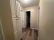 Hallway with built-in storage and vinyl flooring at 350 Chestnut Dr, Covington, GA 30016