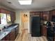 Spacious kitchen with dark wood cabinets, granite countertops, and modern appliances at 350 Chestnut Dr, Covington, GA 30016