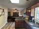 Kitchen with dark wood cabinets and a breakfast bar at 350 Chestnut Dr, Covington, GA 30016