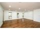 Spacious living room featuring hardwood floors and wainscoting at 4625 Imperial Hills Ct, Tucker, GA 30084