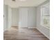 Simple bedroom with vinyl plank flooring and a closet at 1337 Muirforest Dr, Stone Mountain, GA 30088