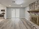 Bright living room with stone fireplace and vinyl plank flooring at 1337 Muirforest Dr, Stone Mountain, GA 30088
