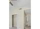 Well-lit bedroom with double door closet and access to hallway at 2213 Asquith Sw Ave, Marietta, GA 30008