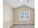Bright bedroom featuring a large window and neutral wall tones at 2213 Asquith Sw Ave, Marietta, GA 30008
