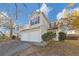 Two-story house with double garage and autumn foliage at 2213 Asquith Sw Ave, Marietta, GA 30008