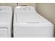 White washer and dryer in a laundry closet at 2213 Asquith Sw Ave, Marietta, GA 30008