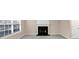 Living room with fireplace, window, and neutral carpet at 2213 Asquith Sw Ave, Marietta, GA 30008