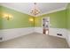 Bright dining room with green walls and a chandelier at 1019 Henna Se Ct, Conyers, GA 30013