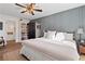 Main bedroom with gray walls, built-in shelves, and ceiling fan at 281 Orchard Dr, Canton, GA 30115