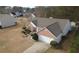 Elevated view of a traditional brick home with a driveway and attached garage at 2910 Evergreen Eve Xing, Dacula, GA 30019