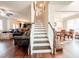 Staircase with white risers and dark wood treads, connecting the main level to the upper floor at 4924 Crider Creek Cv, Powder Springs, GA 30127