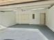 An empty, attached garage with two storage closets and entry door into house at 206 Glen Ivy # 2, Marietta, GA 30062