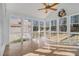 Sunroom with tile floors and windows providing natural light at 4630 Astible Nw Ct, Acworth, GA 30102