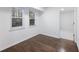 Bright bedroom with hardwood floors and two windows at 4925 Erin Rd, Atlanta, GA 30331