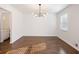 Bright dining room with hardwood floors and a modern chandelier at 4925 Erin Rd, Atlanta, GA 30331