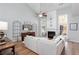 Light and airy living room with hardwood floors and a fireplace at 124 Wallnut Hall Cir, Woodstock, GA 30189