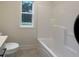 Bathroom featuring white vanity with quartz countertop, tiled floor, and a tub/shower at 236 Harmony Ridge Dr, Temple, GA 30179